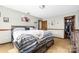Bedroom features carpeted floors, natural light, and a wooden bed frame with storage at 360 Patience Dr, Concord, NC 28025