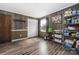 Extra room with wood-look floors, storage shelves, and ample space, perfect for a home office or hobby area at 360 Patience Dr, Concord, NC 28025