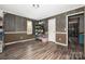 A wood-paneled living room with storage shelves, showcasing its rustic charm and practical storage solutions at 360 Patience Dr, Concord, NC 28025