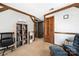 Upper loft area with exposed beams and wooden door; great for a reading nook or workspace at 360 Patience Dr, Concord, NC 28025