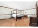 Spacious main bedroom featuring hardwood floors, natural light, and ample room for a king-size bed at 360 Patience Dr, Concord, NC 28025