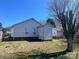 Exterior backyard view of home, showcasing the lawn, siding, and a storage shed, creating a functional outdoor space at 376 Brookgreen Nw Pl, Concord, NC 28027