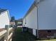 Exterior view of the home, showcasing the siding, well-maintained lawn, and neighboring houses at 376 Brookgreen Nw Pl, Concord, NC 28027