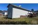 Exterior of the home showcasing the siding, well-maintained lawn, and a glimpse of the deck, perfect for outdoor enjoyment at 376 Brookgreen Nw Pl, Concord, NC 28027