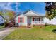 Charming single-story home featuring red shutters and a welcoming front porch at 376 Brookgreen Nw Pl, Concord, NC 28027