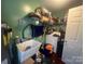 Functional laundry area with utility sink, washer, and storage shelving; needs organizing at 376 Brookgreen Nw Pl, Concord, NC 28027
