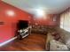 Comfortable living room features a sectional sofa and plenty of space for relaxation and entertainment at 376 Brookgreen Nw Pl, Concord, NC 28027