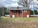 Brick house featuring a back entrance and a small porch with metal railings at 4137 Poplar Tent Rd, Concord, NC 28027