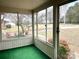 Relaxing screened porch with views of the front yard and neighborhood at 4137 Poplar Tent Rd, Concord, NC 28027