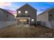 Backyard with a covered patio, perfect for entertaining or relaxing outdoors at 439 Newfound Hollow Dr, Charlotte, NC 28214