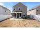 A fenced backyard features a covered porch and patio, perfect for outdoor enjoyment and entertaining at 439 Newfound Hollow Dr, Charlotte, NC 28214