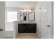 Elegant bathroom with double vanity, granite countertop, and a stylish tile floor at 439 Newfound Hollow Dr, Charlotte, NC 28214