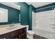 Bathroom features a wooden vanity, stone countertop, shower, and tub combo, offering both functionality and a clean design at 439 Newfound Hollow Dr, Charlotte, NC 28214