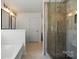 Bathroom featuring a glass shower, soaking tub, and double vanity with modern fixtures at 439 Newfound Hollow Dr, Charlotte, NC 28214