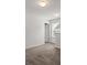 Carpeted bedroom featuring a door and window at 439 Newfound Hollow Dr, Charlotte, NC 28214