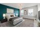 Inviting bedroom features a decorative chandelier, ample natural light, and neutral color scheme at 439 Newfound Hollow Dr, Charlotte, NC 28214