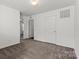 Neutral bedroom with carpeted flooring and attached doors at 439 Newfound Hollow Dr, Charlotte, NC 28214