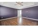 A well-lit bedroom with hardwood floors, neutral walls, and a ceiling fan for added comfort at 439 Newfound Hollow Dr, Charlotte, NC 28214