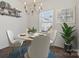 Charming dining room with a modern chandelier, round table, and bright natural light at 439 Newfound Hollow Dr, Charlotte, NC 28214