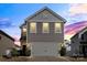 Charming two-story home featuring a gray exterior, a two-car garage, and well-maintained landscaping at 439 Newfound Hollow Dr, Charlotte, NC 28214
