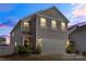Charming two-story home featuring a gray exterior, a two-car garage, and well-maintained landscaping at 439 Newfound Hollow Dr, Charlotte, NC 28214