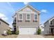 Charming two-story home featuring a gray exterior, a two-car garage, and well-maintained landscaping at 439 Newfound Hollow Dr, Charlotte, NC 28214