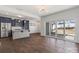 Bright, open-concept kitchen with stainless appliances, gray cabinetry, and sliding doors to patio at 439 Newfound Hollow Dr, Charlotte, NC 28214