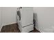 The updated laundry room features modern, efficient appliances with wood-look floors at 439 Newfound Hollow Dr, Charlotte, NC 28214