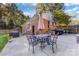 Spacious backyard with a patio area, an outdoor dining set, and a barbecue grill at 4635 General Pershing Dr, Charlotte, NC 28209