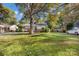 Expansive front yard featuring mature trees and a well-kept lawn at 4635 General Pershing Dr, Charlotte, NC 28209