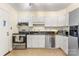 Features stainless steel appliances, white cabinets, and granite countertops at 4635 General Pershing Dr, Charlotte, NC 28209