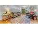 Bright living room featuring hardwood floors and a comfortable seating area at 4635 General Pershing Dr, Charlotte, NC 28209