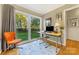 Inviting home office with large windows offering serene backyard views at 4635 General Pershing Dr, Charlotte, NC 28209