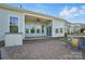 Large backyard with covered patio, outdoor kitchen, and ample space for recreation at 5004 Oakmere Rd, Waxhaw, NC 28173