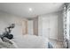 Neutral bedroom features a large queen size bed, a ceiling fan, a closet and an exercise bike at 5004 Oakmere Rd, Waxhaw, NC 28173