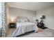 Bedroom featuring a window, a ceiling fan, exercise bike and a comfortable queen bed at 5004 Oakmere Rd, Waxhaw, NC 28173