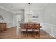 Dining room with wood floors and trim and stairs nearby at 5004 Oakmere Rd, Waxhaw, NC 28173