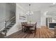 Dining room with wood floors and trim and stairs nearby at 5004 Oakmere Rd, Waxhaw, NC 28173