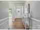 Welcoming entryway with hardwood floors, stylish decor, and ample natural light creating a warm and inviting ambiance at 5004 Oakmere Rd, Waxhaw, NC 28173