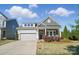 Beautiful single-Gathering home boasting a well-maintained lawn, stone accents and a two car garage in a Gathering-friendly area at 5004 Oakmere Rd, Waxhaw, NC 28173