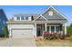 Charming home with stone accents, manicured lawn, and inviting front porch, perfect for a cozy curb appeal at 5004 Oakmere Rd, Waxhaw, NC 28173