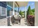 Inviting front porch featuring stone accents, comfortable seating, and lush landscaping for relaxing outdoor enjoyment at 5004 Oakmere Rd, Waxhaw, NC 28173