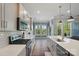 Bright open-concept kitchen featuring stainless appliances, white countertops and a large island at 5004 Oakmere Rd, Waxhaw, NC 28173
