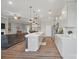 Spacious open-concept kitchen and living area featuring hardwood floors and modern design at 5004 Oakmere Rd, Waxhaw, NC 28173