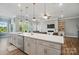 Bright kitchen with stainless steel appliances, ample counter space, and an open layout, ideal for cooking and entertaining at 5004 Oakmere Rd, Waxhaw, NC 28173