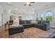 Open-concept living space with ample seating, lots of natural light and a seamless flow to the dining and kitchen areas at 5004 Oakmere Rd, Waxhaw, NC 28173