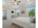 Bright and spacious main bedroom with large windows and an ensuite bathroom with tile floors at 5004 Oakmere Rd, Waxhaw, NC 28173