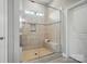 Walk-in shower with glass door and bench seating at 5004 Oakmere Rd, Waxhaw, NC 28173