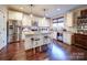 Bright kitchen featuring stainless steel appliances, white cabinets and granite countertops at 508 Summerfield Pl, Belmont, NC 28012