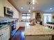 Well-lit kitchen featuring stainless steel appliances, granite countertops, and an island with pendant lighting at 508 Summerfield Pl, Belmont, NC 28012